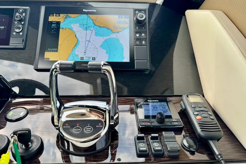 Orion Yacht Photos Pics Control panel of 2018 Carver C52 Coupe with navigation and communication equipment.