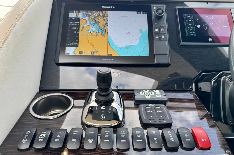 Orion Yacht Photos Pics Control panel of 2018 Carver C52 Coupe with navigation and control buttons.