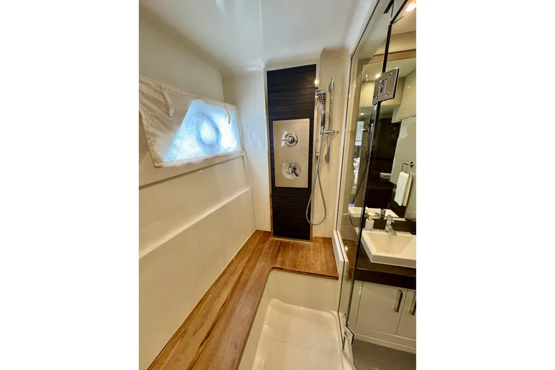 Orion Yacht Photos Pics Luxurious bathroom in 2018 Carver C52 Coupe yacht with modern shower and sleek design.