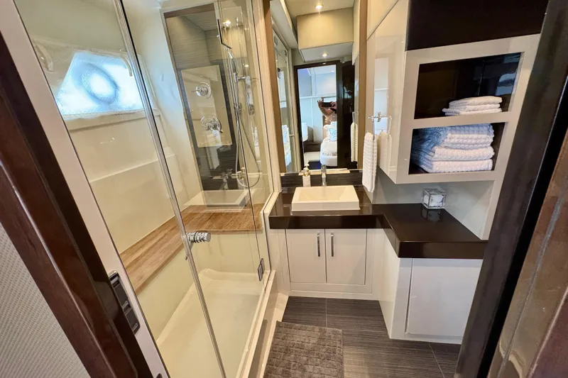 Orion Yacht Photos Pics Luxurious bathroom in 2018 Carver C52 Coupe yacht with modern fixtures and ample storage.
