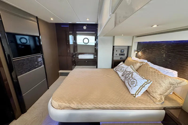 Orion Yacht Photos Pics Luxurious interior of 2018 Carver C52 Coupe yacht with elegant bedding and modern design.