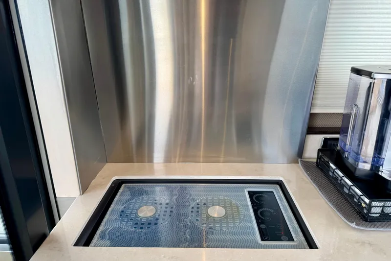 Orion Yacht Photos Pics Modern kitchen area in 2018 Carver C52 Coupe with sleek induction cooktop.