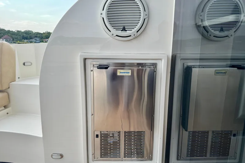 Orion Yacht Photos Pics 2018 Carver C52 Coupe yacht with built-in Hatteras refrigerator and speaker.