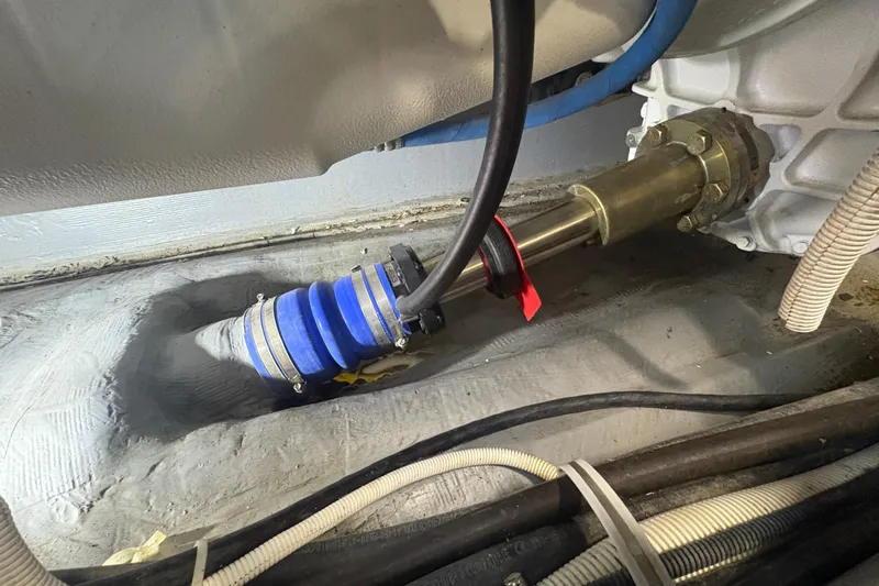 Orion Yacht Photos Pics Engine compartment of 2018 Carver C52 Coupe showing mechanical components and hoses.