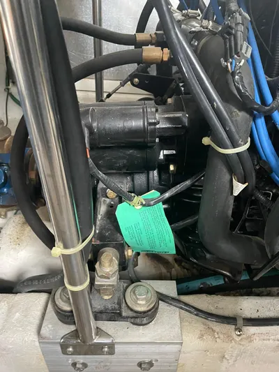  Yacht Photos Pics Engine compartment of a 2000 Carver 400 Express boat, featuring various mechanical components.