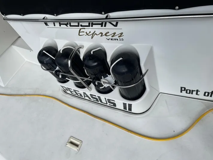  Yacht Photos Pics 2000 Carver 400 Express boat with fenders and "PEGASUS II" name displayed.