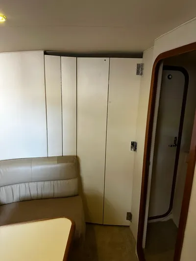  Yacht Photos Pics Interior of 2000 Carver 400 Express yacht with seating and cabin door.