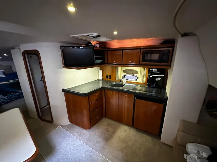  Yacht Photos Pics Interior of 2000 Carver 400 Express yacht with kitchenette, TV, and microwave.