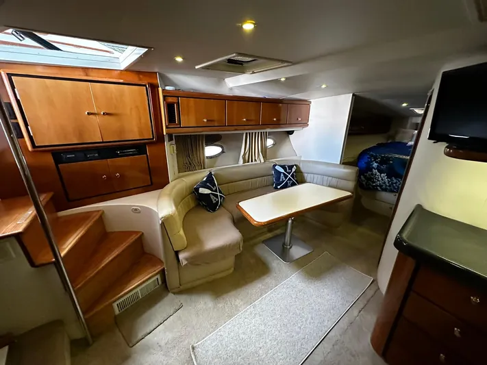  Yacht Photos Pics Interior of 2000 Carver 400 Express yacht with cozy seating and wooden cabinetry.