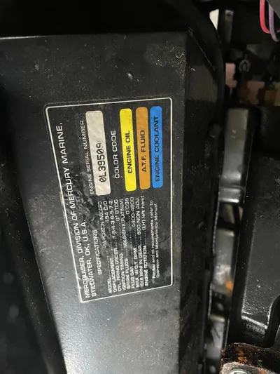  Yacht Photos Pics Label on Mercury Marine engine, Carver 400 Express 2000, showing oil and coolant information.