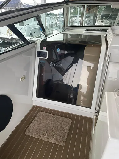  Yacht Photos Pics 2000 Carver 400 Express boat interior with carpeted floor and glass door.