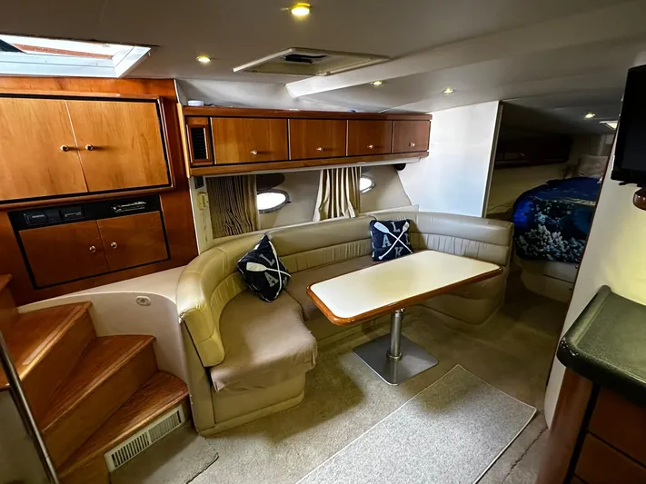  Yacht Photos Pics Interior of 2000 Carver 400 Express yacht with cozy seating and wooden cabinetry.