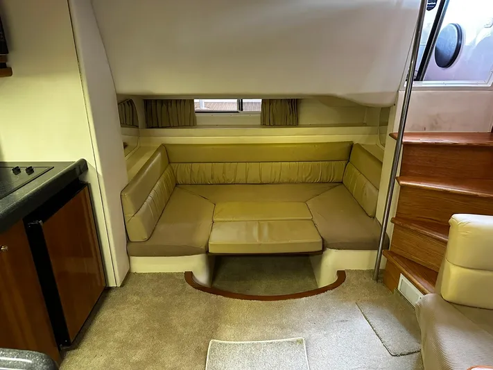  Yacht Photos Pics Interior of 2000 Carver 400 Express yacht with cozy seating area and stairs.
