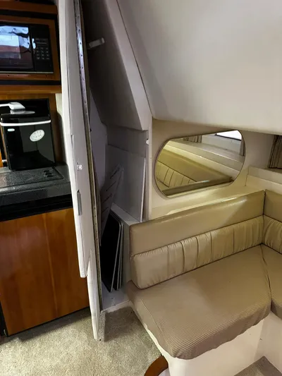  Yacht Photos Pics Interior of 2000 Carver 400 Express yacht with kitchenette and seating area.