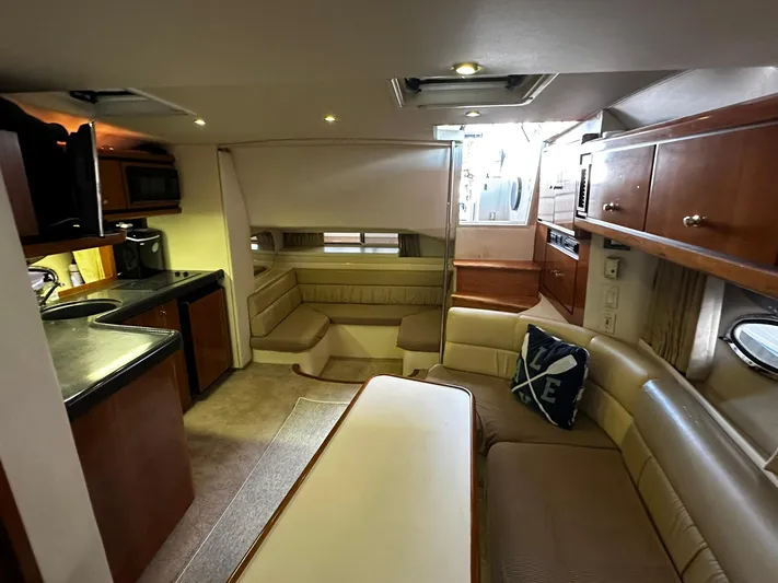  Yacht Photos Pics Interior of 2000 Carver 400 Express yacht with cozy seating and kitchenette.