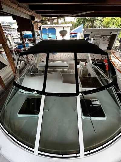  Yacht Photos Pics 2000 Carver 400 Express boat docked under shelter, featuring spacious deck and sleek design.