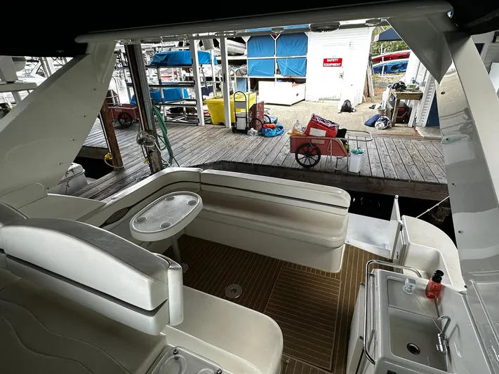  Yacht Photos Pics 2000 Carver 400 Express yacht interior with seating and dock view.