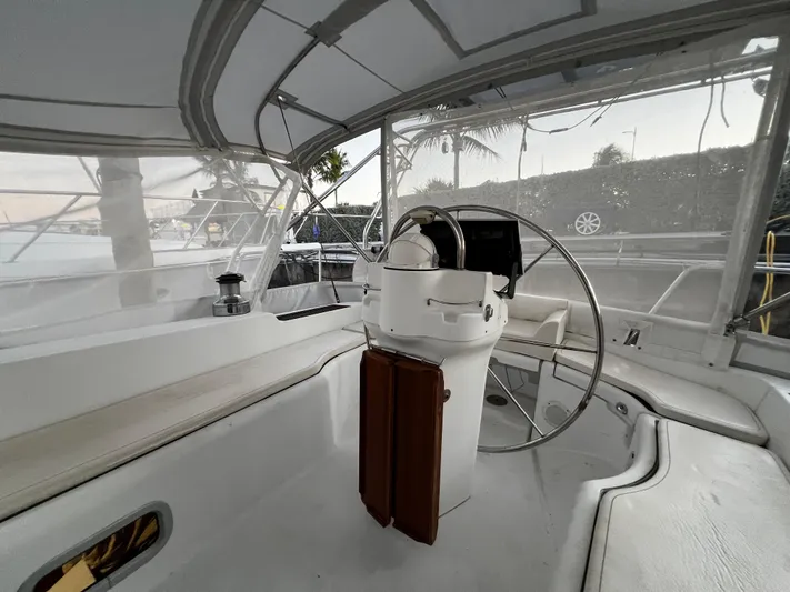 Monlove Yacht Photos Pics Cockpit of 2007 Beneteau Oceanis Clipper 393 sailboat with steering wheel and seating.