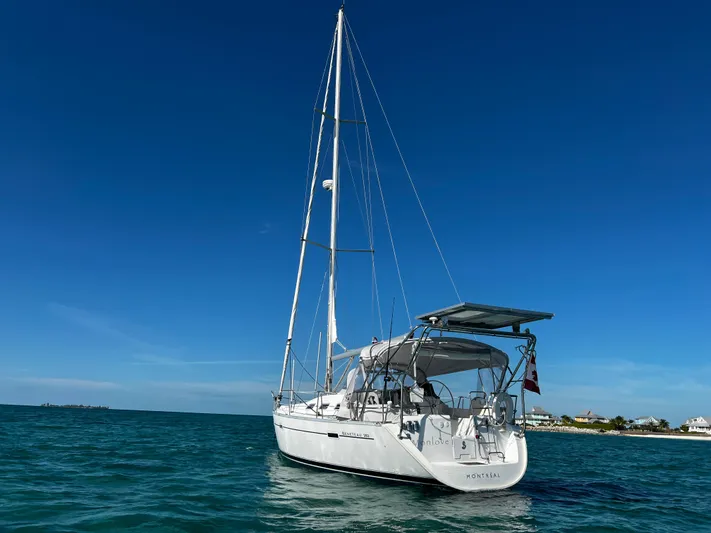 Monlove Yacht Photos Pics Sailing yacht Beneteau Oceanis Clipper 393, 2007 model, anchored in calm blue waters.