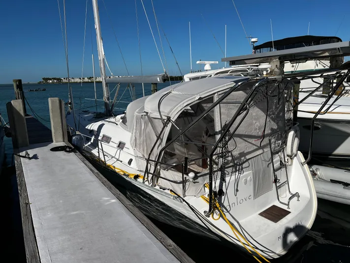 Monlove Yacht Photos Pics 2007 Beneteau Oceanis Clipper 393 sailboat docked at marina under clear blue sky.
