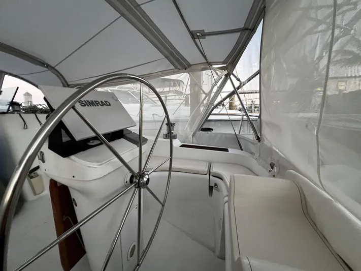 Monlove Yacht Photos Pics Steering area of 2007 Beneteau Oceanis Clipper 393 sailboat with Simrad navigation system.