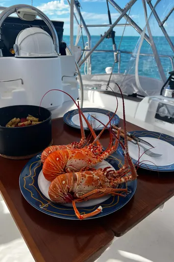 Monlove Yacht Photos Pics Fresh lobsters served on a Beneteau Oceanis Clipper 393 yacht, 2007 model, with ocean view.
