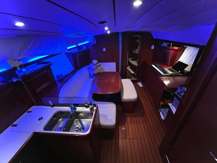 Monlove Yacht Photos Pics Interior of 2007 Beneteau Oceanis Clipper 393 yacht with modern lighting and wood finish.