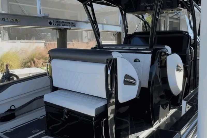  Yacht Photos Pics 2022 Nor-Tech 390 Sport interior with sleek black and white seating design.
