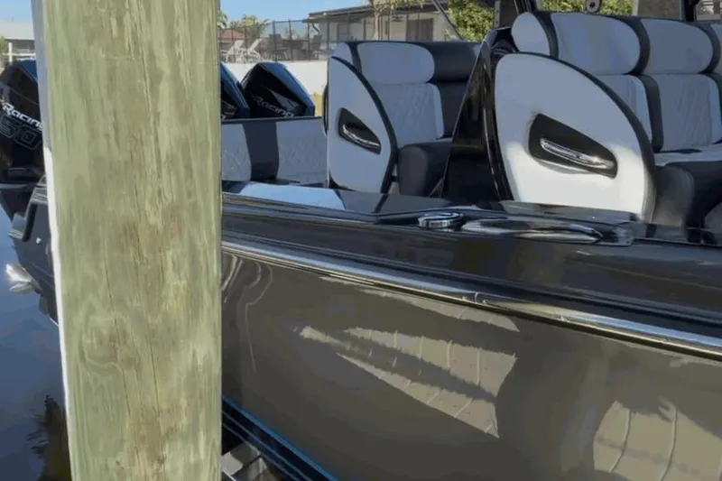  Yacht Photos Pics 2022 Nor-Tech 390 Sport boat with sleek seating and powerful engines docked.