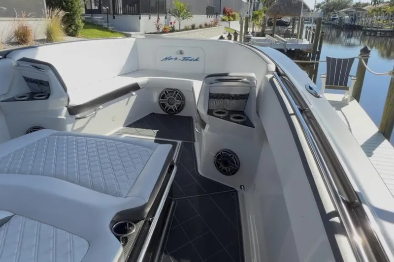  Yacht Photos Pics 2022 Nor-Tech 390 Sport boat interior with luxurious seating and modern design.
