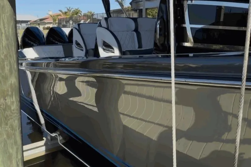  Yacht Photos Pics 2022 Nor-Tech 390 Sport boat docked, featuring sleek design and luxurious seating.