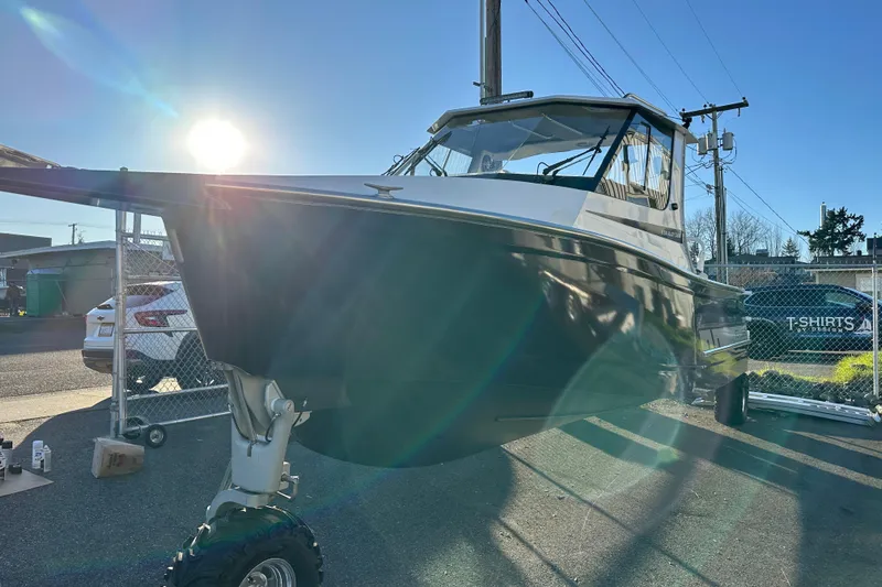  Yacht Photos Pics 2026 Sealegs 8.5m Cabin boat with wheels, parked outdoors in sunlight.