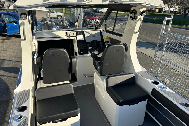  Yacht Photos Pics 2026 Sealegs 8.5m Cabin boat interior with dual seats and navigation system.