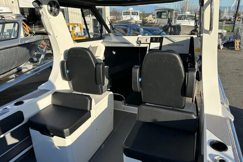  Yacht Photos Pics 2026 Sealegs 8.5m Cabin interior with Garmin navigation system and black seating.