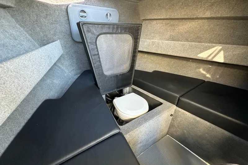  Yacht Photos Pics Interior of 2026 Sealegs 8.5m Cabin with compact toilet and seating.