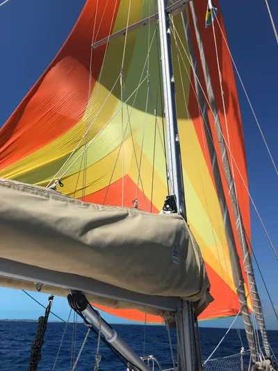 Chandelle Yacht Photos Pics Colorful sails on a 2008 Alubat OVNI 435 yacht against a clear blue sky.