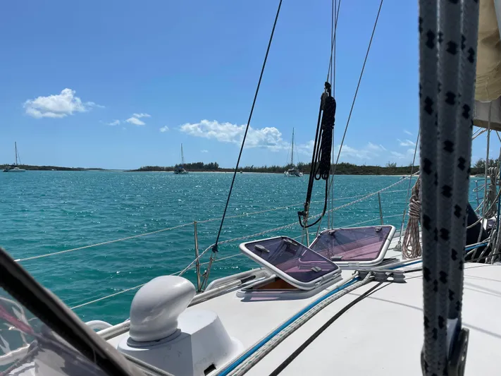 Chandelle Yacht Photos Pics Sailing on a 2008 Alubat OVNI 435 yacht in clear turquoise waters under a sunny sky.