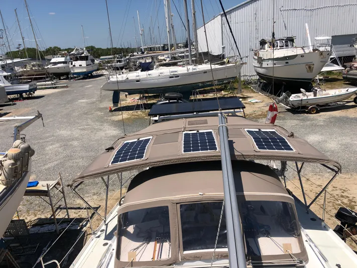Chandelle Yacht Photos Pics 2008 Alubat OVNI 435 sailboat with solar panels in a marina.