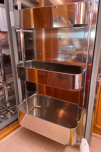 Chandelle Yacht Photos Pics Stainless steel shelving unit in a 2008 Alubat OVNI 435 yacht interior.