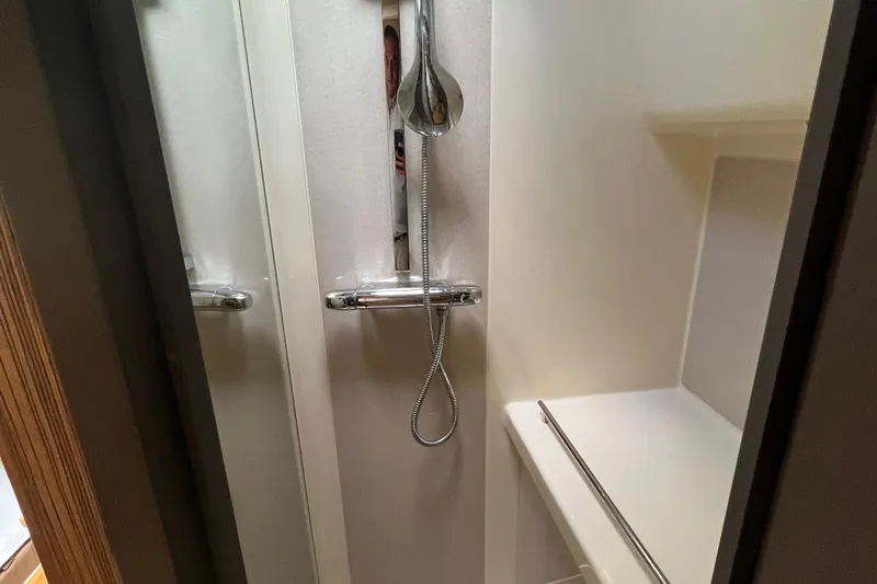  Yacht Photos Pics Shower area inside 2016 Chris-Craft Launch 36 boat, featuring modern fixtures and sleek design.