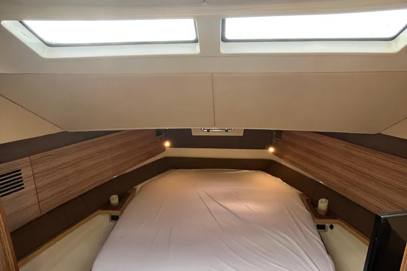  Yacht Photos Pics Interior cabin of 2016 Chris-Craft Launch 36 with skylights and cozy bed.