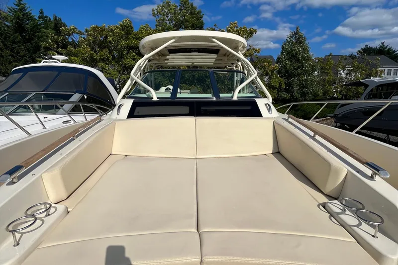  Yacht Photos Pics 2016 Chris-Craft Launch 36 boat with spacious seating and cup holders, docked outdoors.