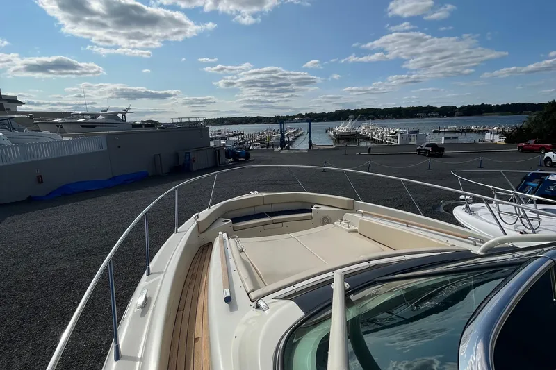  Yacht Photos Pics 2016 Chris-Craft Launch 36 yacht docked at a marina under a partly cloudy sky.