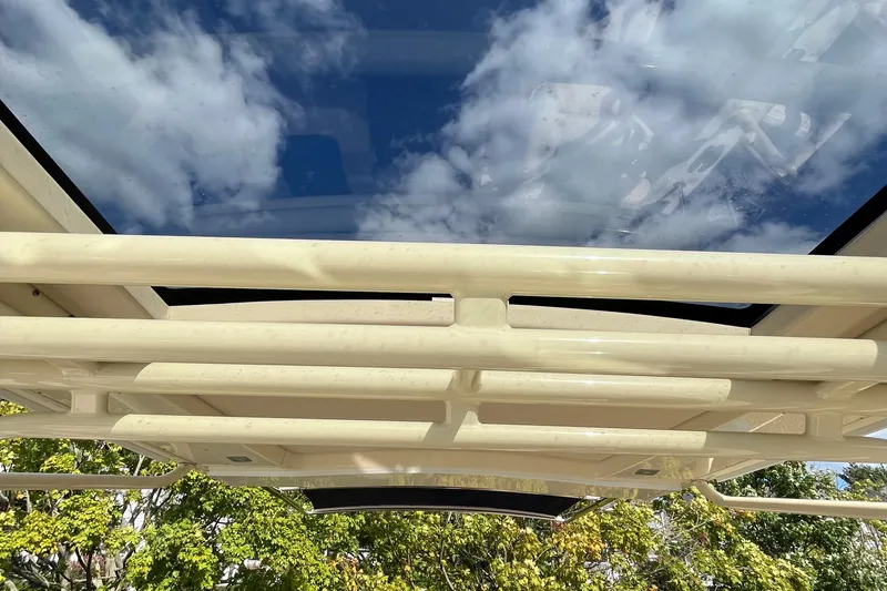  Yacht Photos Pics 2016 Chris-Craft Launch 36 boat roof with clear sky and clouds reflection.