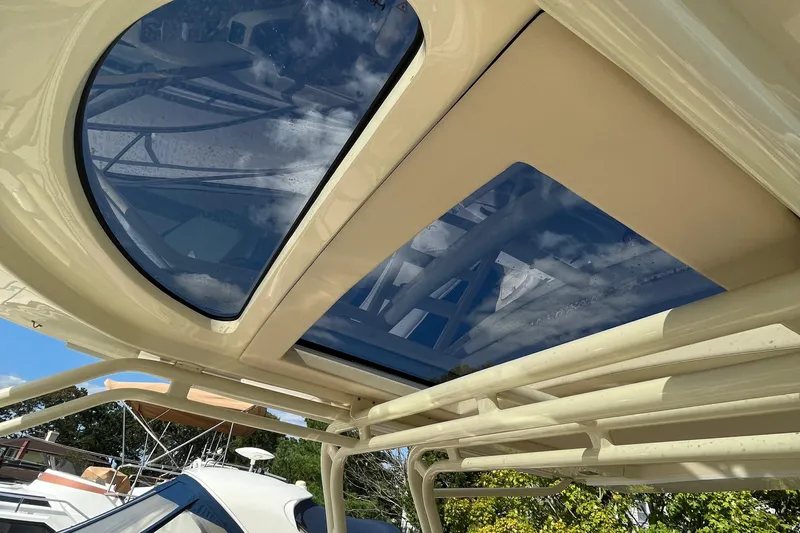  Yacht Photos Pics 2016 Chris-Craft Launch 36 boat with sunroof and clear blue sky reflection.