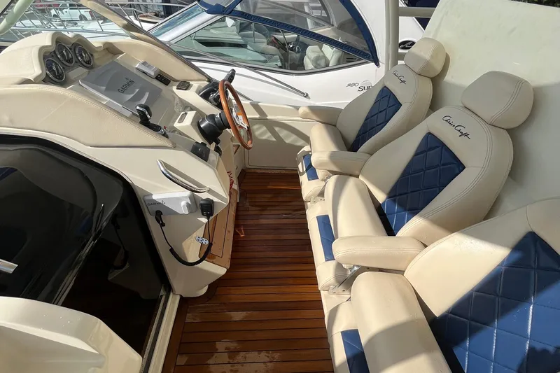  Yacht Photos Pics 2016 Chris-Craft Launch 36 interior with leather seats and wooden flooring.