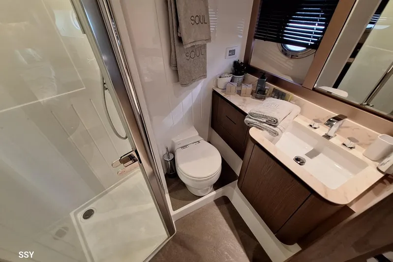 Soul Yacht Photos Pics Luxurious bathroom in 2022 Azimut Magellano 66 yacht with modern fixtures and elegant design.