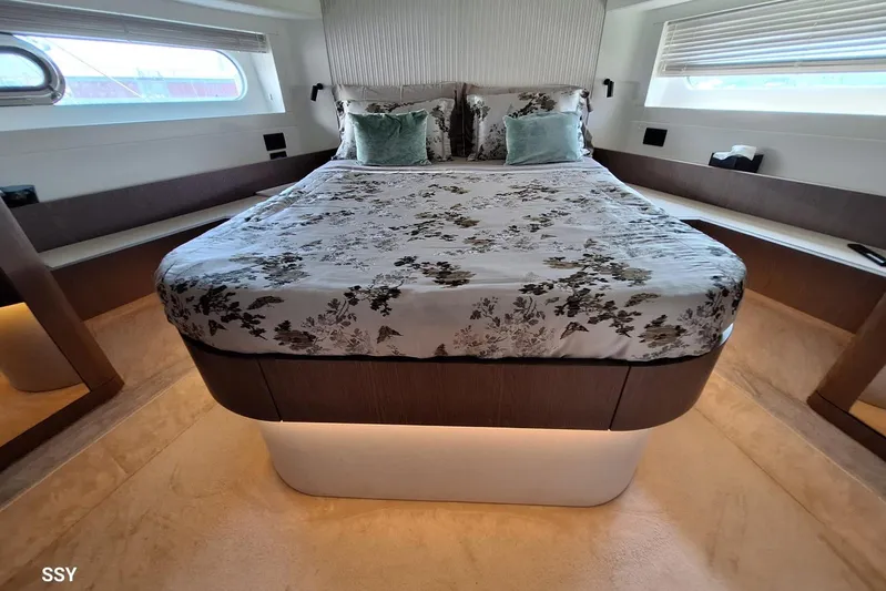 Soul Yacht Photos Pics Luxurious bedroom interior of 2022 Azimut Magellano 66 yacht with elegant bedding.