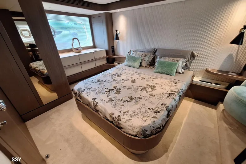 Soul Yacht Photos Pics Luxurious bedroom interior of 2022 Azimut Magellano 66 yacht with elegant decor and modern furnishings.
