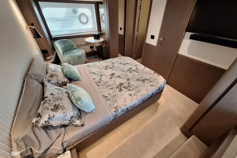 Soul Yacht Photos Pics Luxurious bedroom interior of 2022 Azimut Magellano 66 yacht with elegant decor and furnishings.